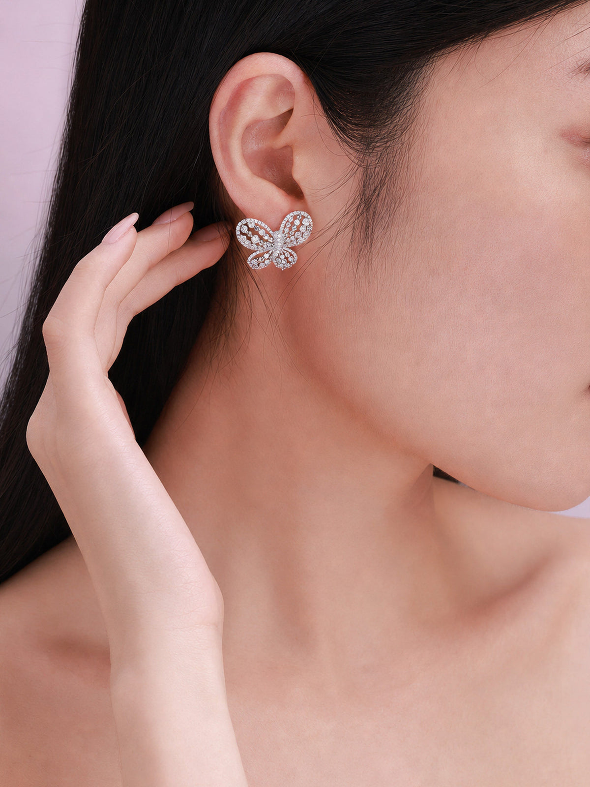 Model wearing Papillon butterfly lab-grown diamond stud earring