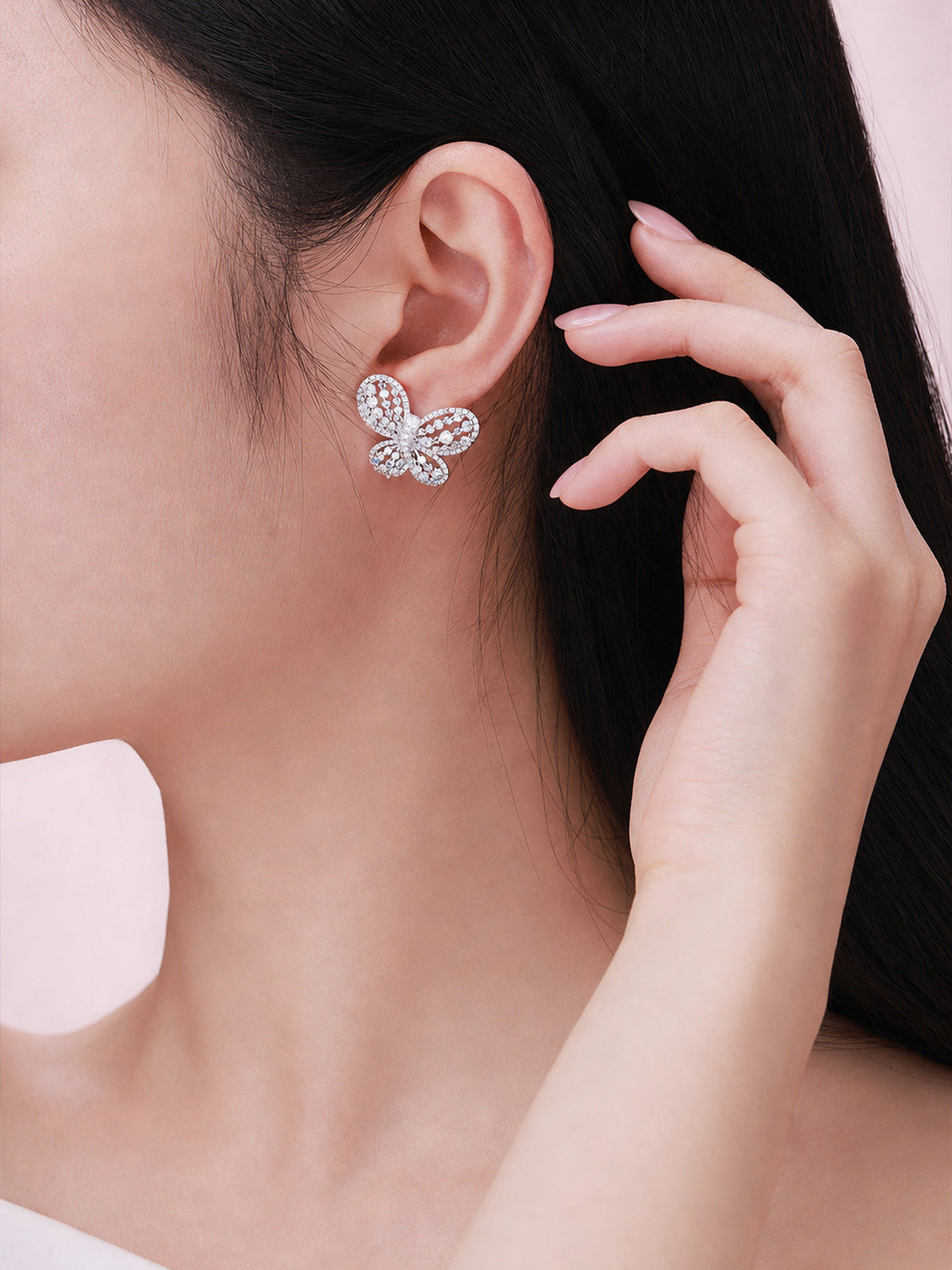 Papillon butterfly diamond stud earring worn on the ear