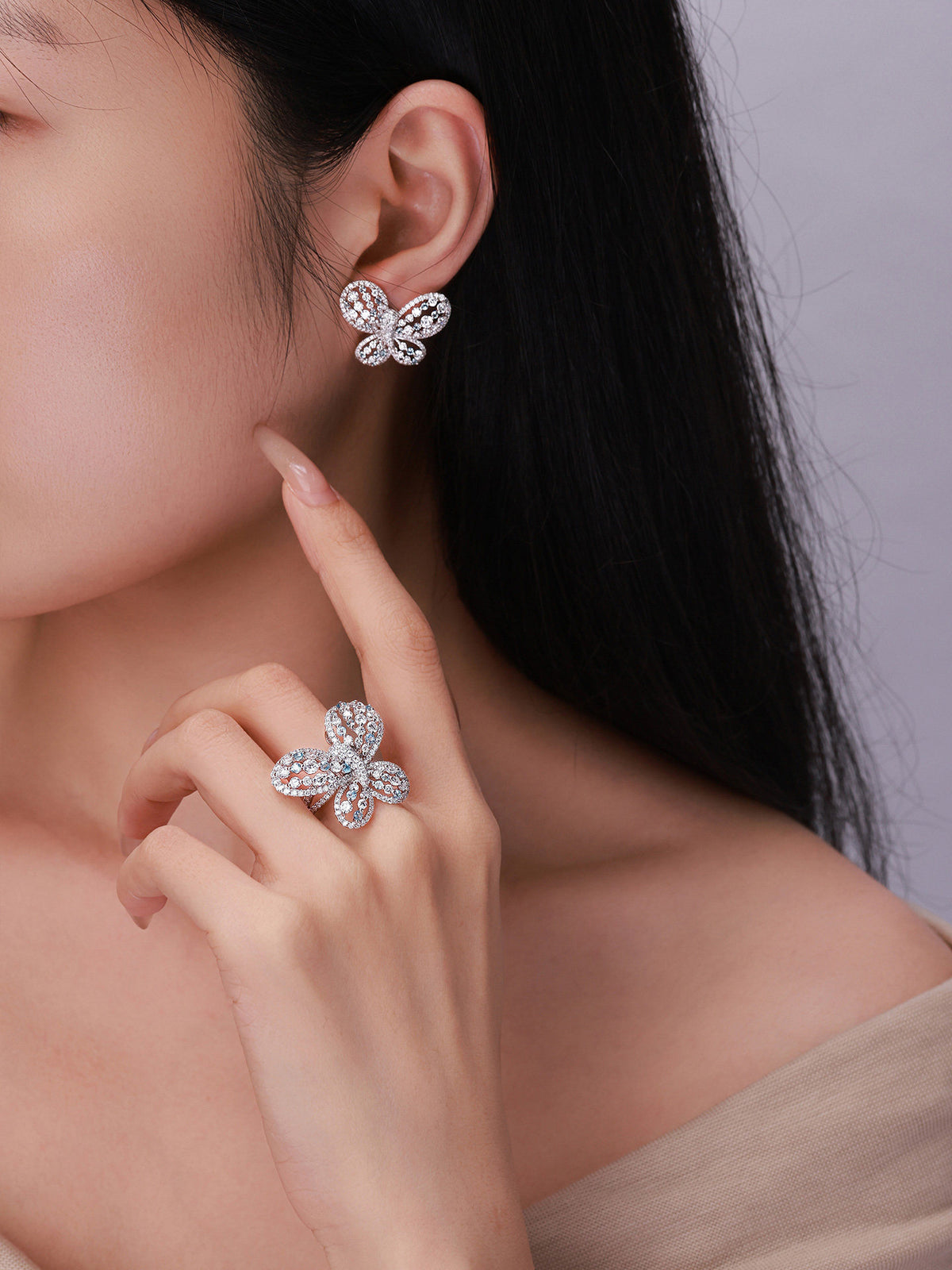 Model wearing Papillon butterfly diamond stud earring