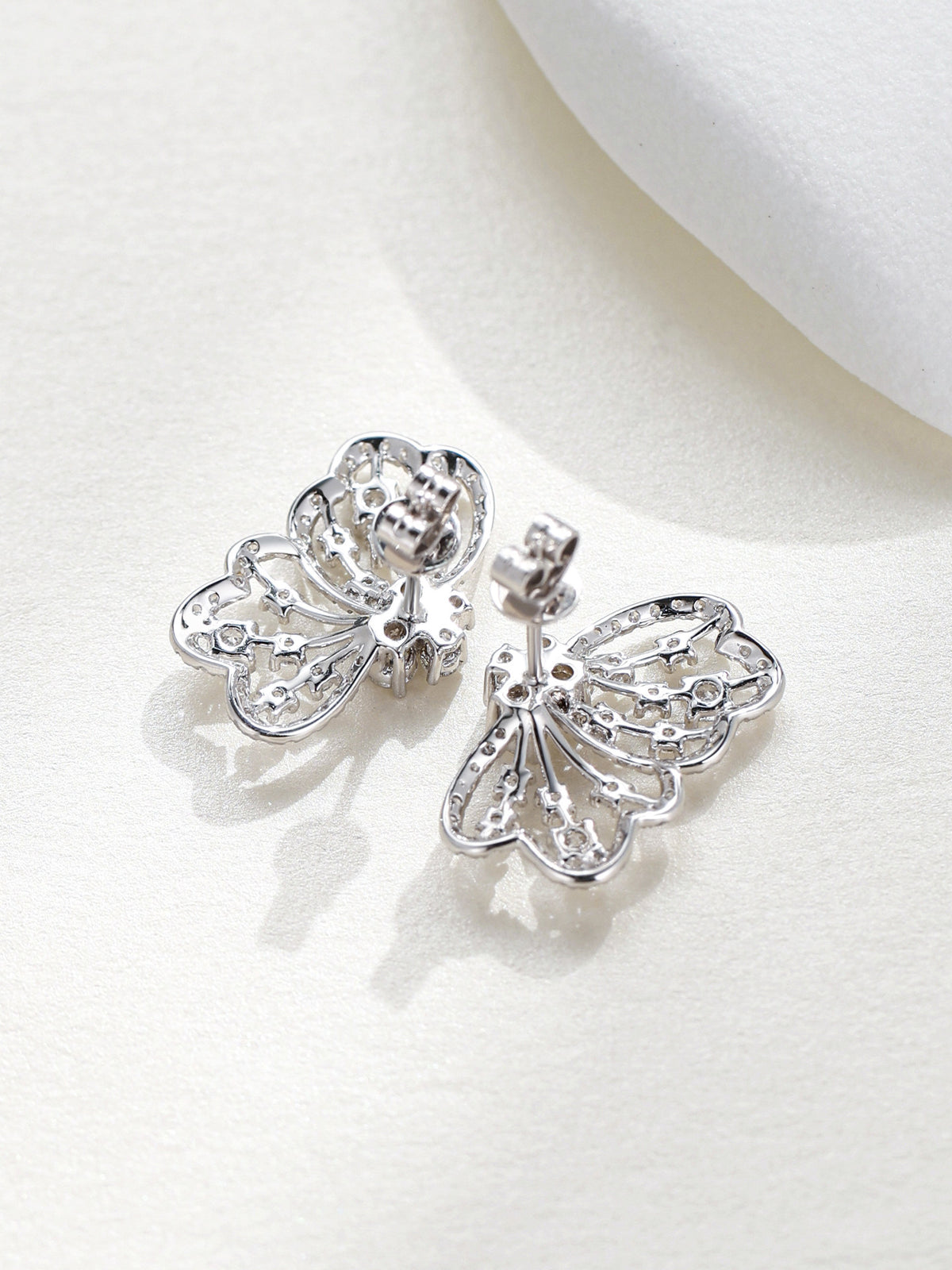 Back view of Papillon butterfly diamond stud earrings showing post and butterfly back