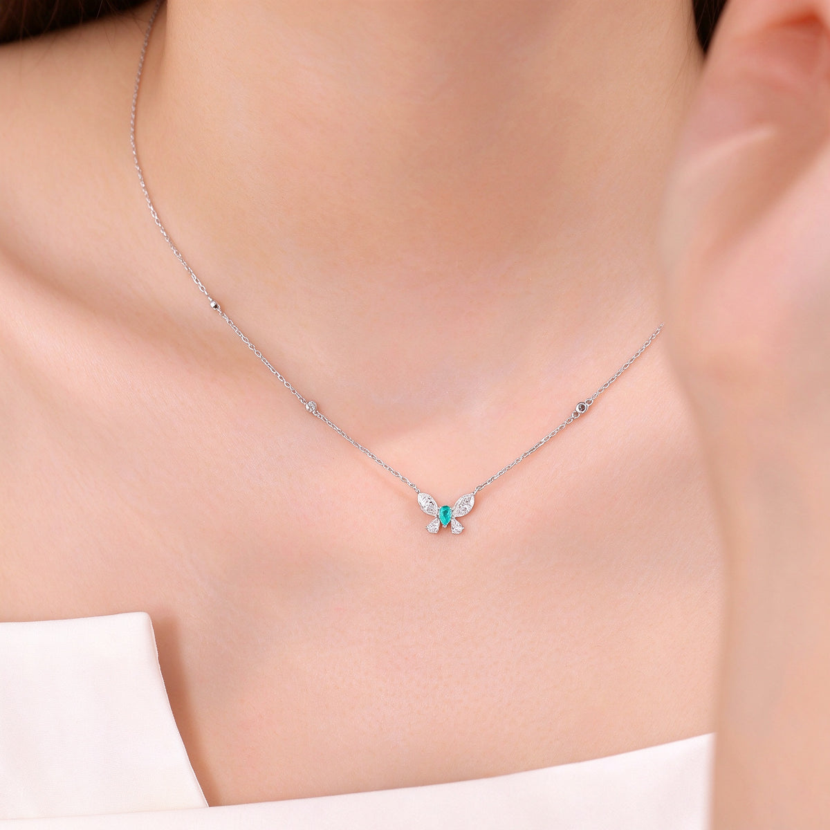 DANFÉE Paraiba butterfly lab-grown diamond necklace worn at the collarbone
