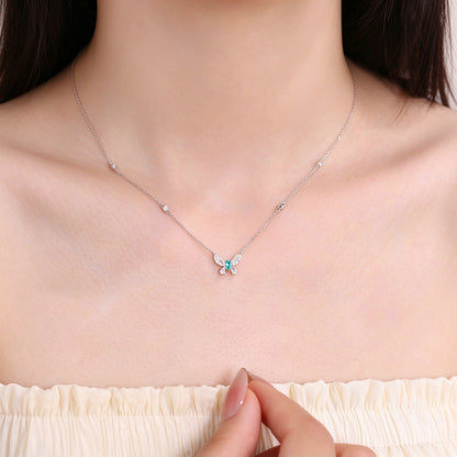 Model wearing the DANFÉE Paraiba butterfly diamond necklace on an 18 inch chain