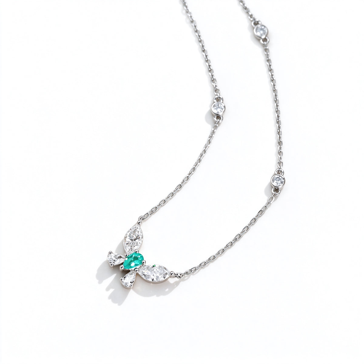 Side view of the DANFÉE butterfly necklace with marquise and pear lab-grown diamonds