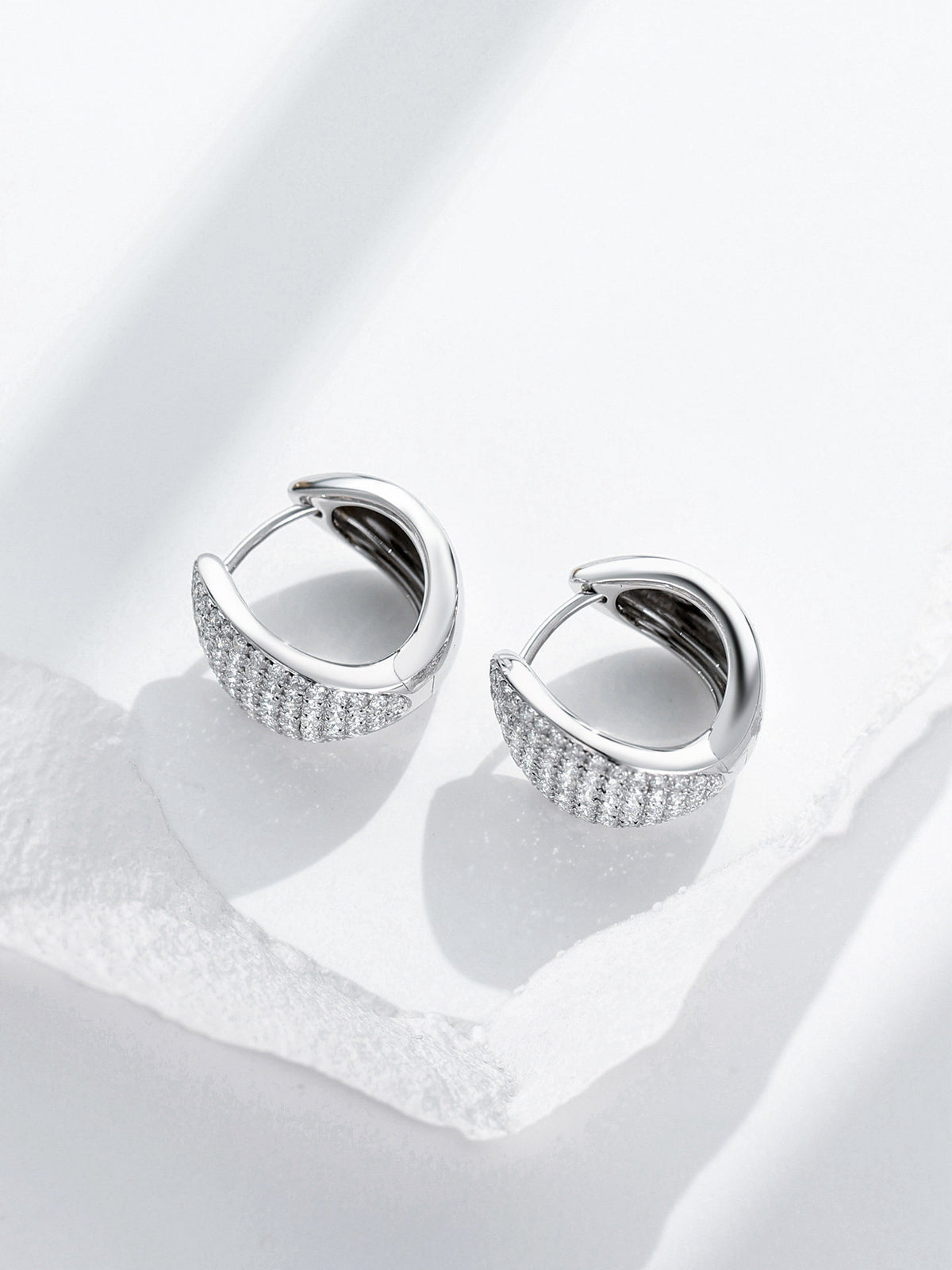 Pavé lab-grown diamond huggie earrings top view