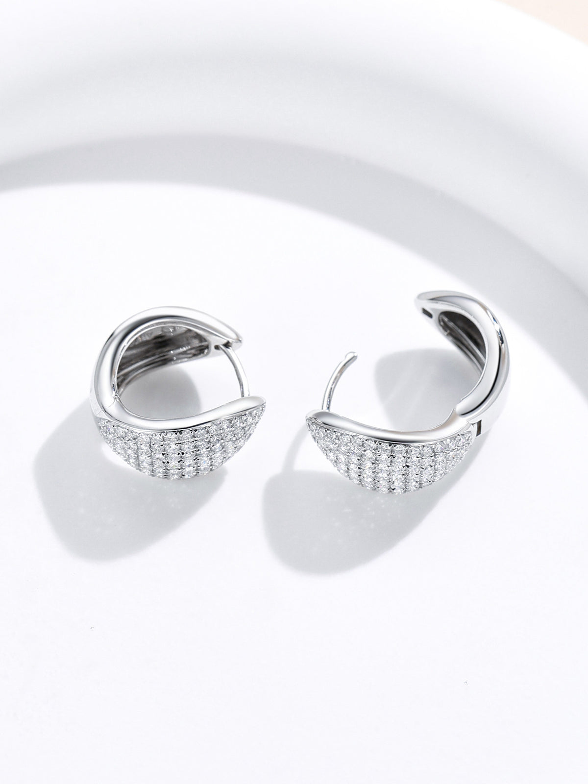 Huggie earrings with hinged closure open