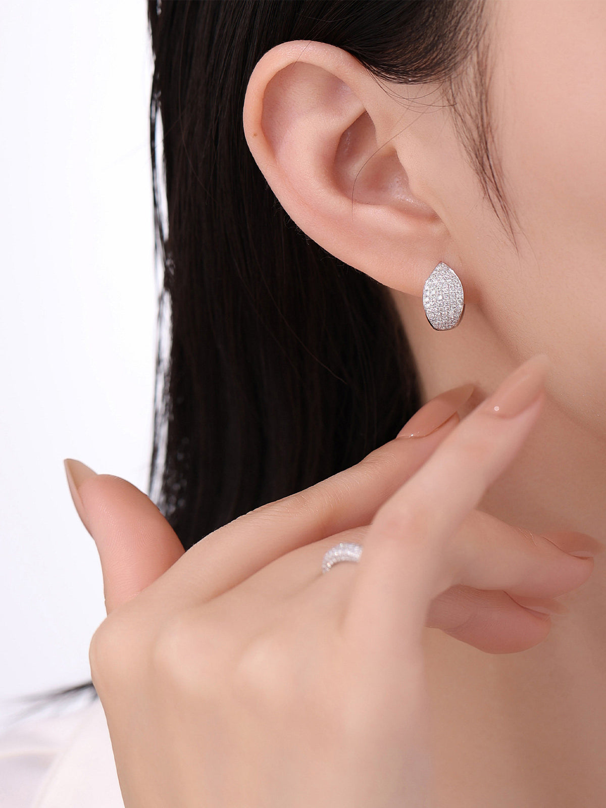 Pavé lab-grown diamond huggie earring worn on the ear