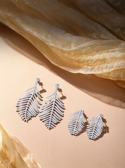 Large and small sizes of the Plume feather lab-grown diamond earrings side by side