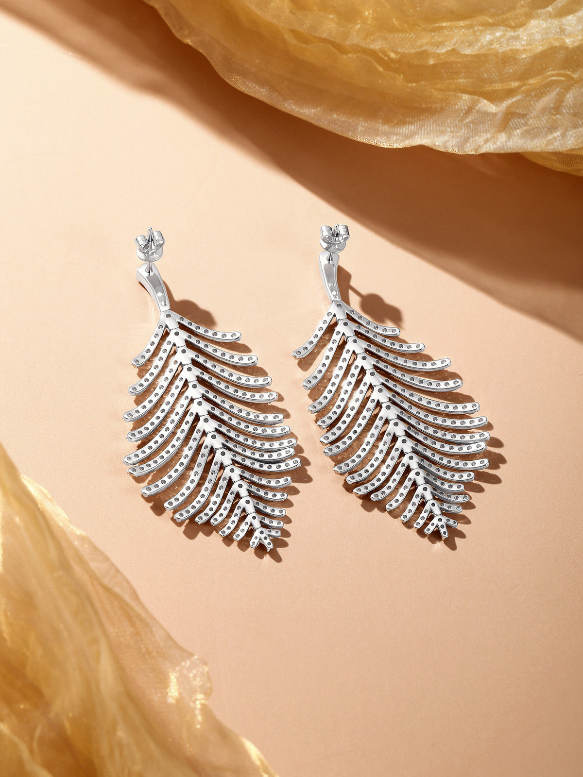 Back of the feather diamond earrings showing open gallery and push-back butterfly posts