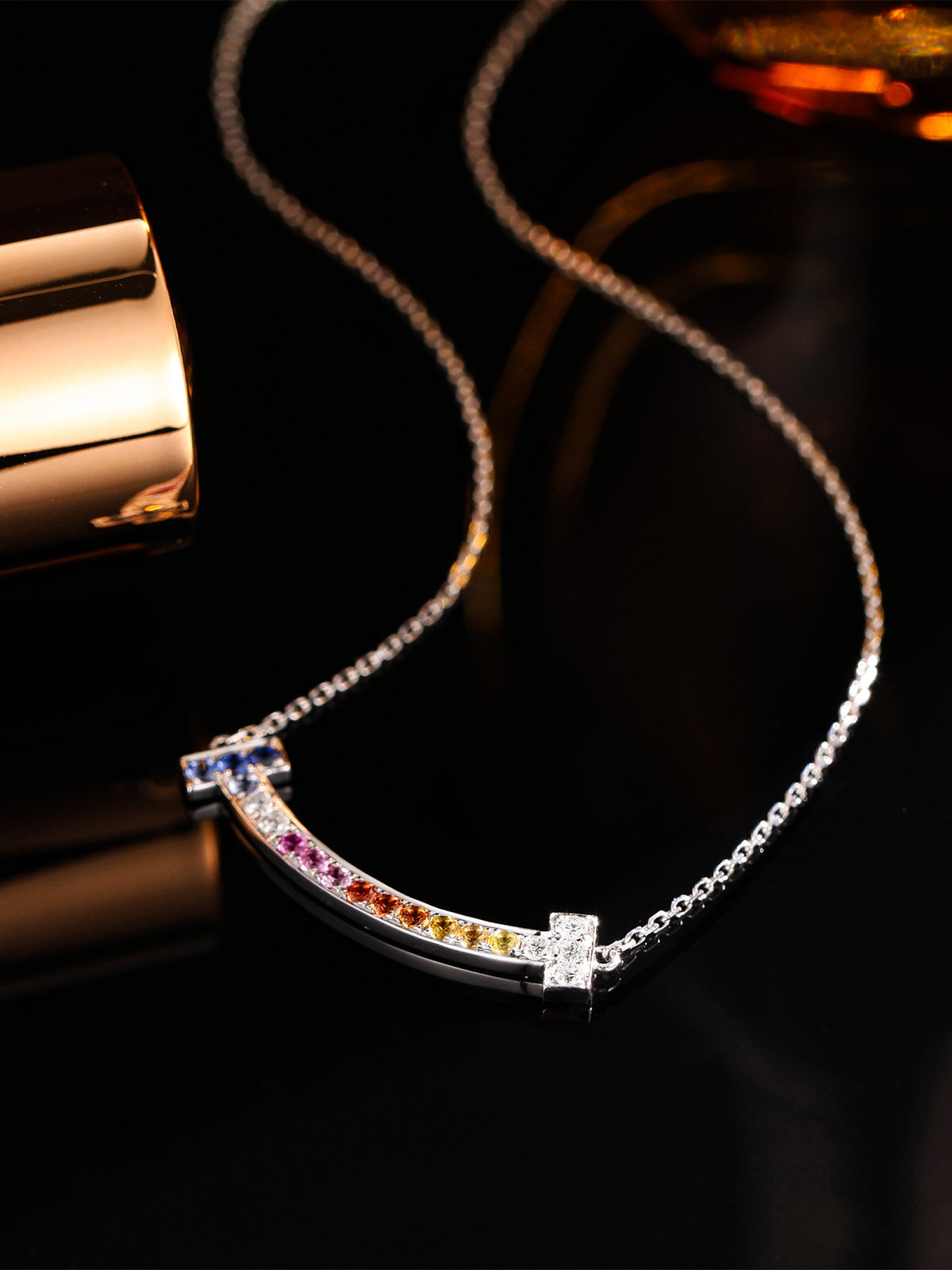 DANFÉE Rainbow Smile lab-grown diamond necklace on dark background