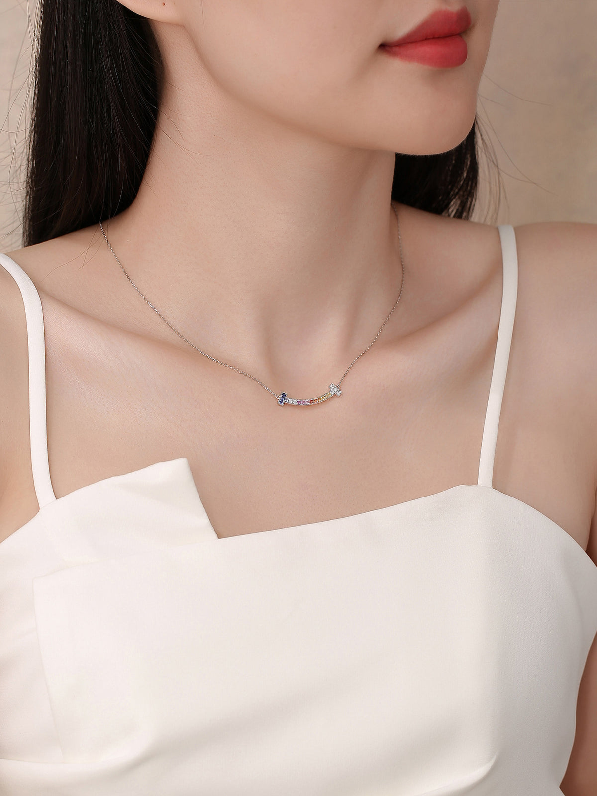 DANFÉE Rainbow Smile necklace on model with white camisole