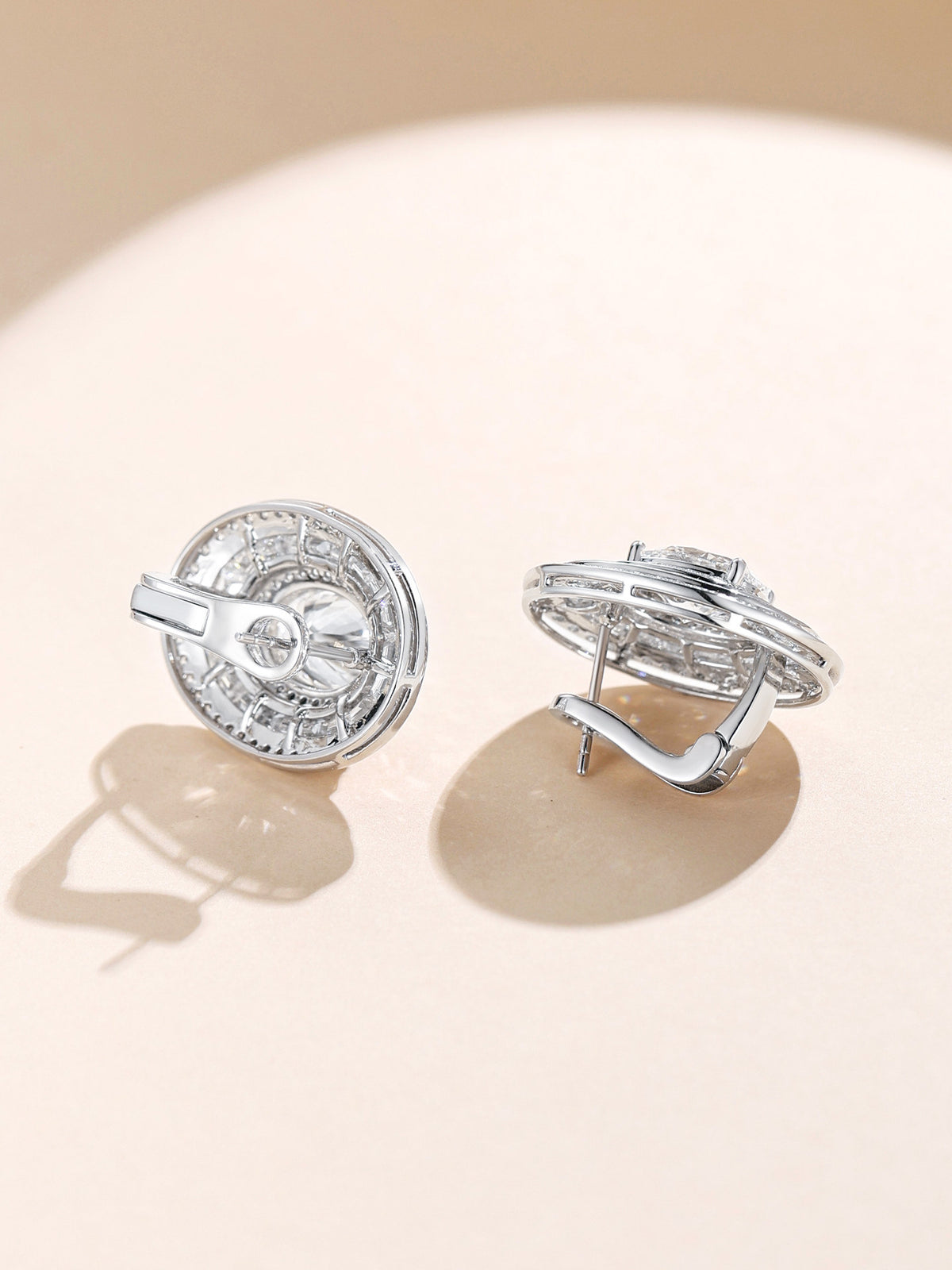 Side and back view of PT950 platinum oval halo earrings with omega clip closure