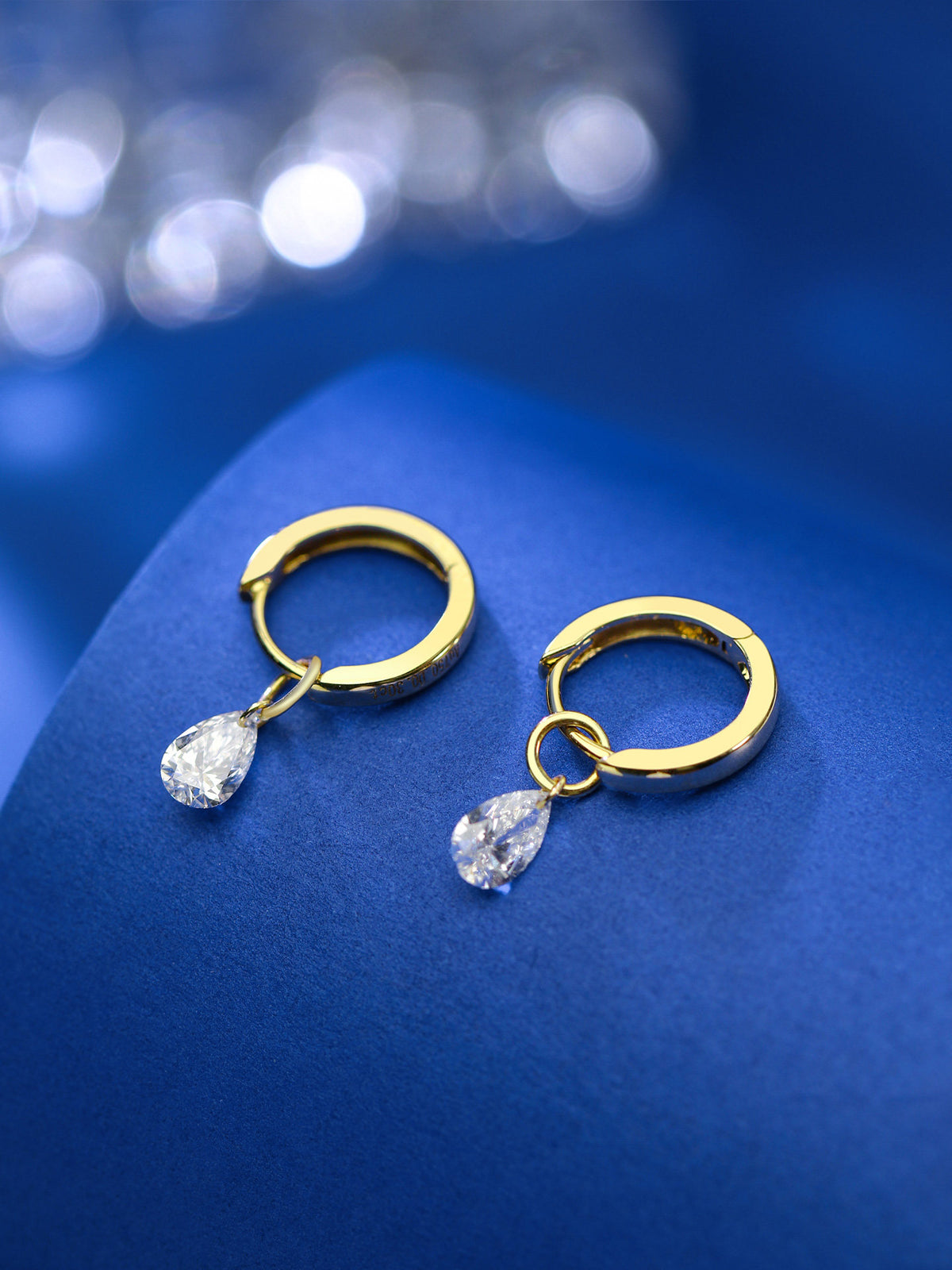 18K gold huggie hoops with pear diamond drops and engraved hallmark