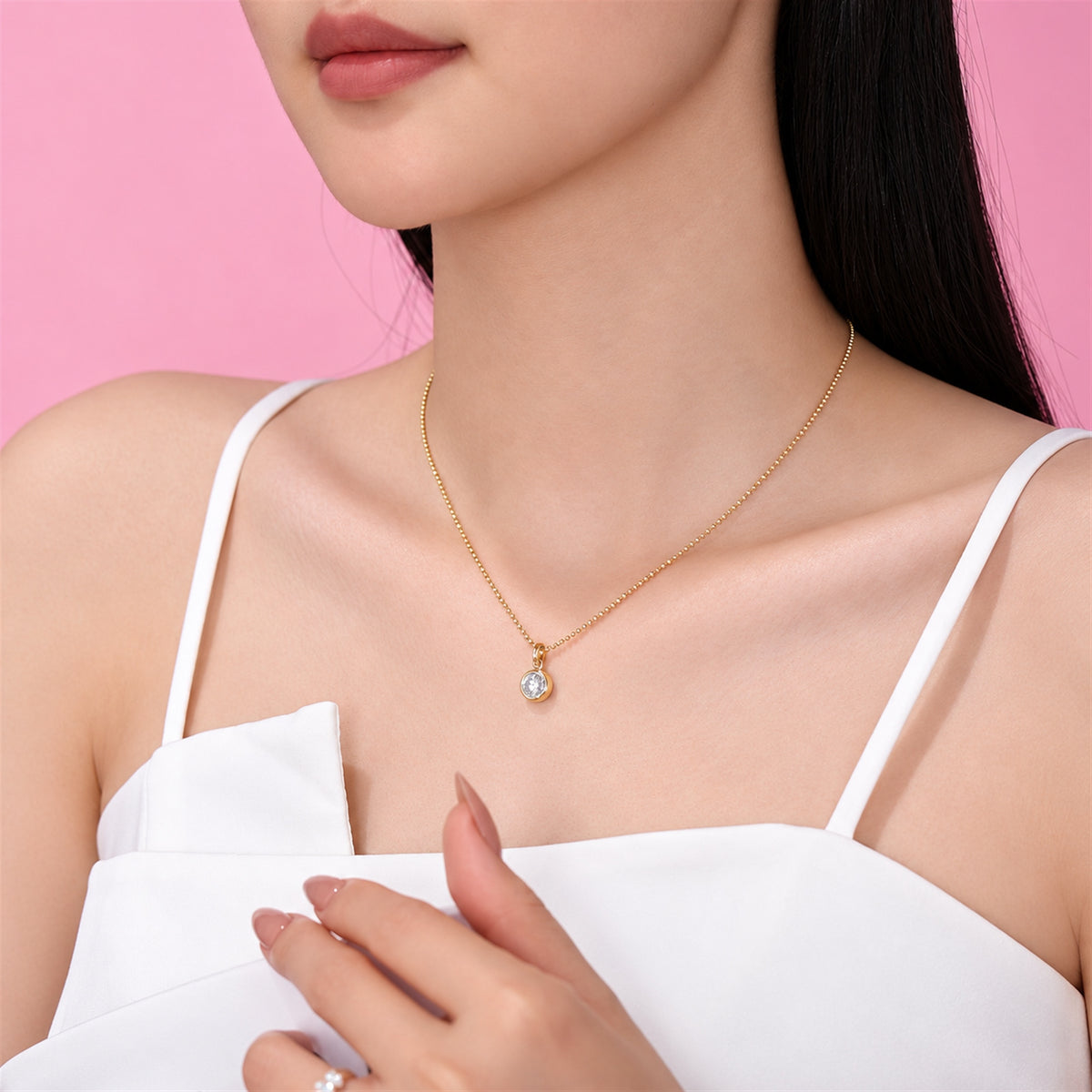 DANFÉE round bezel lab-grown diamond necklace in 18K yellow gold worn with a white top