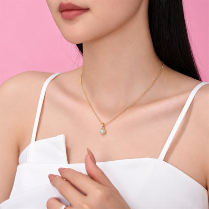 DANFÉE round bezel lab-grown diamond necklace in 18K yellow gold worn with a white top