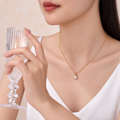 DANFÉE round bezel lab-grown diamond necklace in 18K yellow gold worn with a white V-neck top