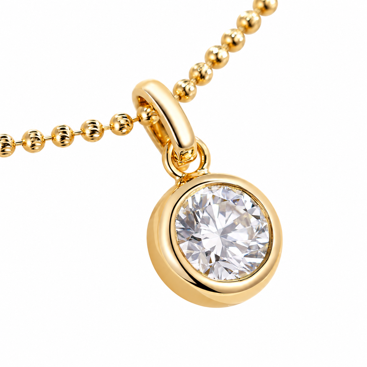 DANFÉE round bezel diamond pendant in 18K yellow gold on white, angled view
