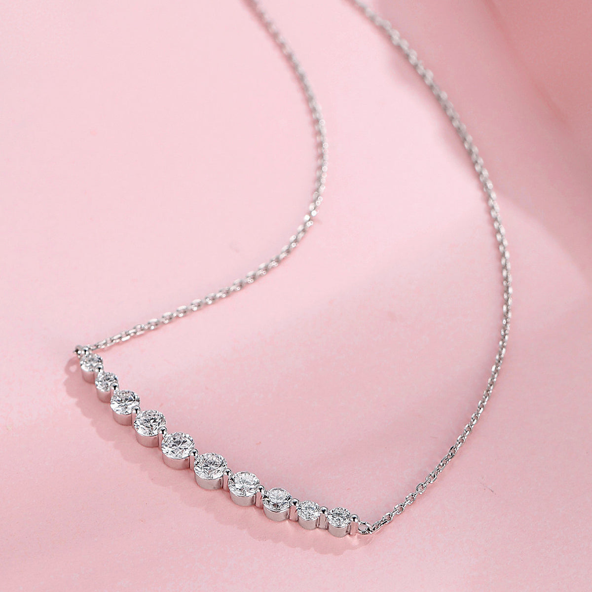 DANFÉE Smile lab-grown diamond necklace styled on a soft pink background