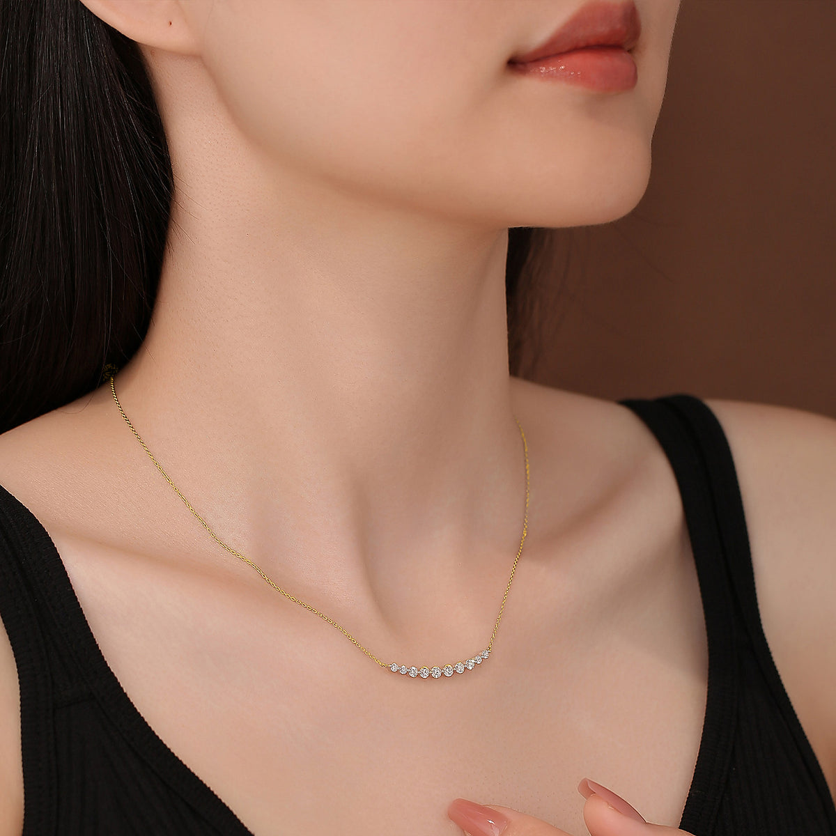 DANFÉE Smile 18K yellow gold diamond necklace worn at the collarbone