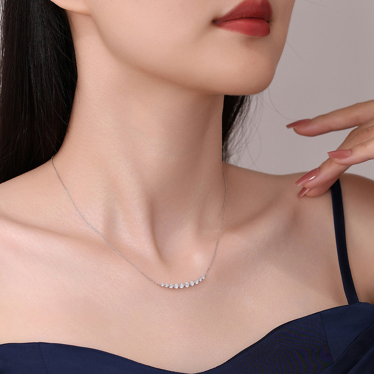 Model wearing the DANFÉE Smile diamond bar necklace in 18K white gold