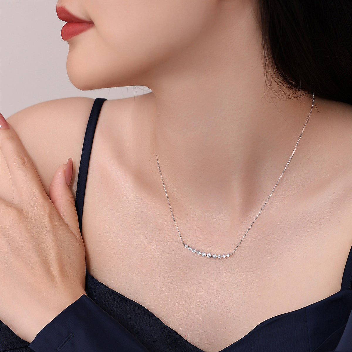 DANFÉE Smile 18K white gold diamond necklace worn with a silk camisole