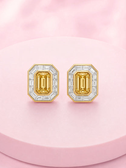 Pair of Fancy Intense Yellow emerald-cut diamond stud earrings with baguette halo, front view