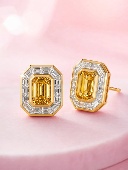 Yellow lab-grown diamond halo stud earrings in 18K gold, angled view