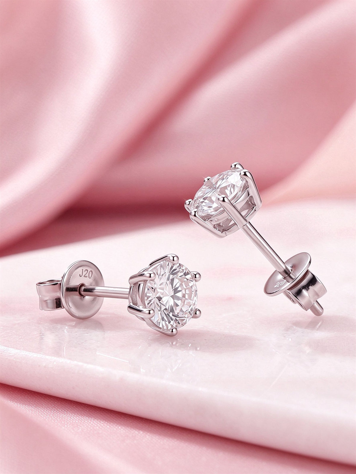 Side view of six-prong diamond stud earrings with butterfly push backs