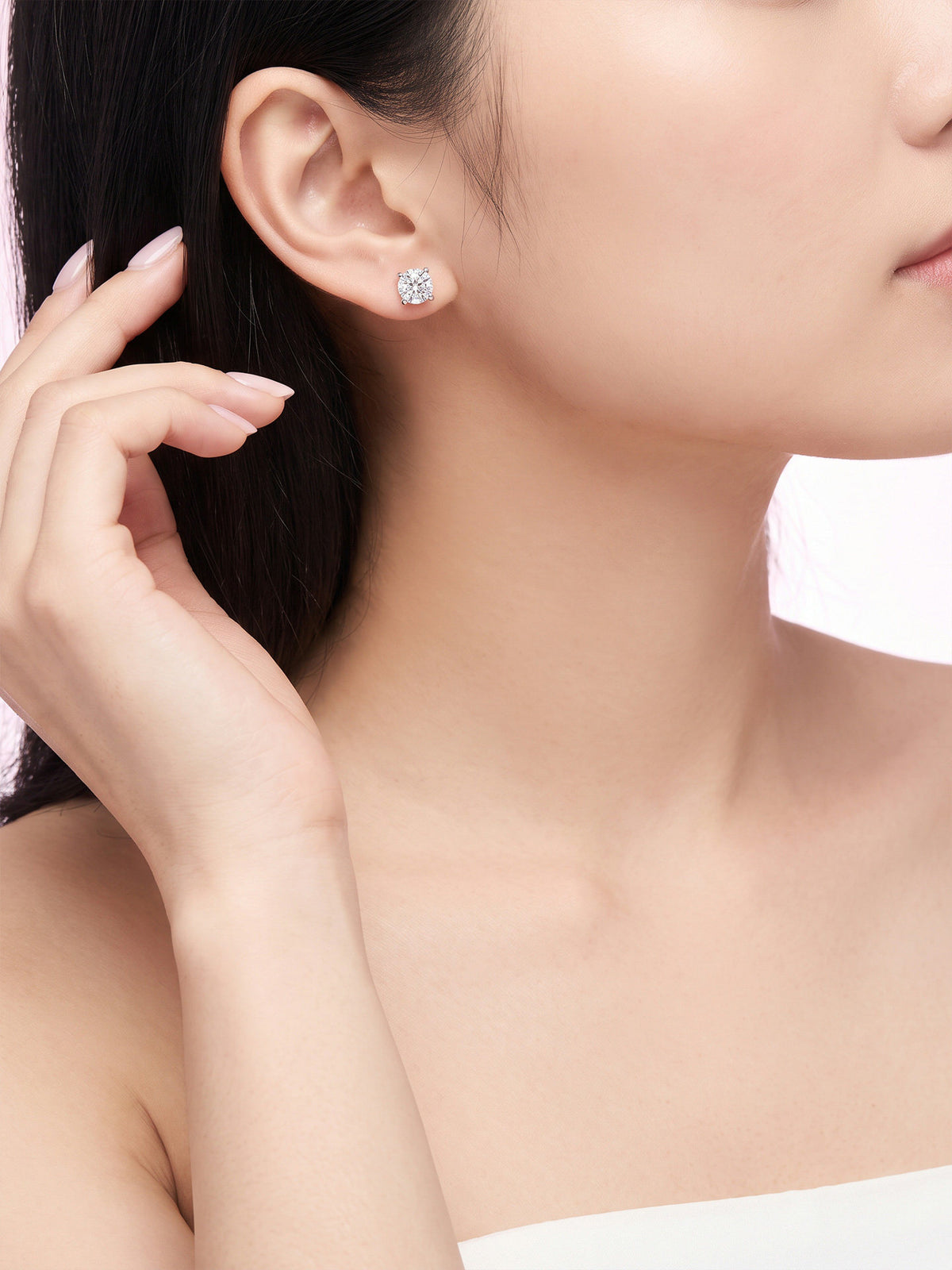 Diamond solitaire stud earring on model