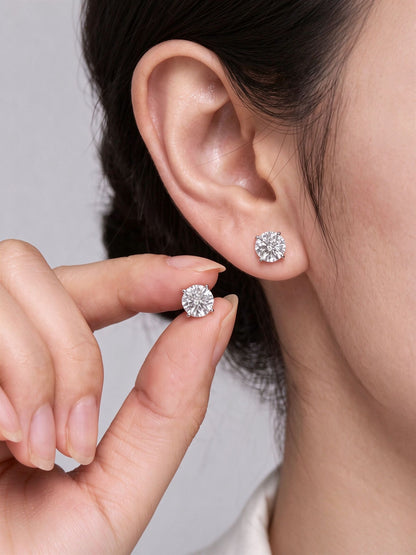 Lab-grown diamond stud earrings, size shown in hand and on ear