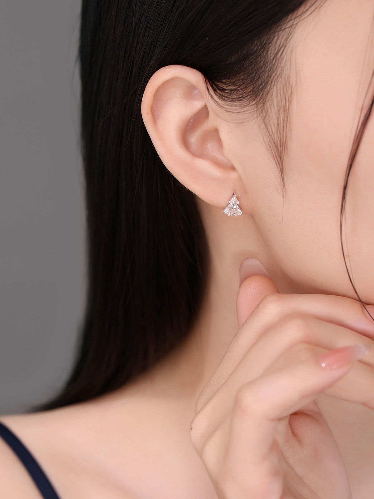 Fighter jet diamond stud earring styled on model