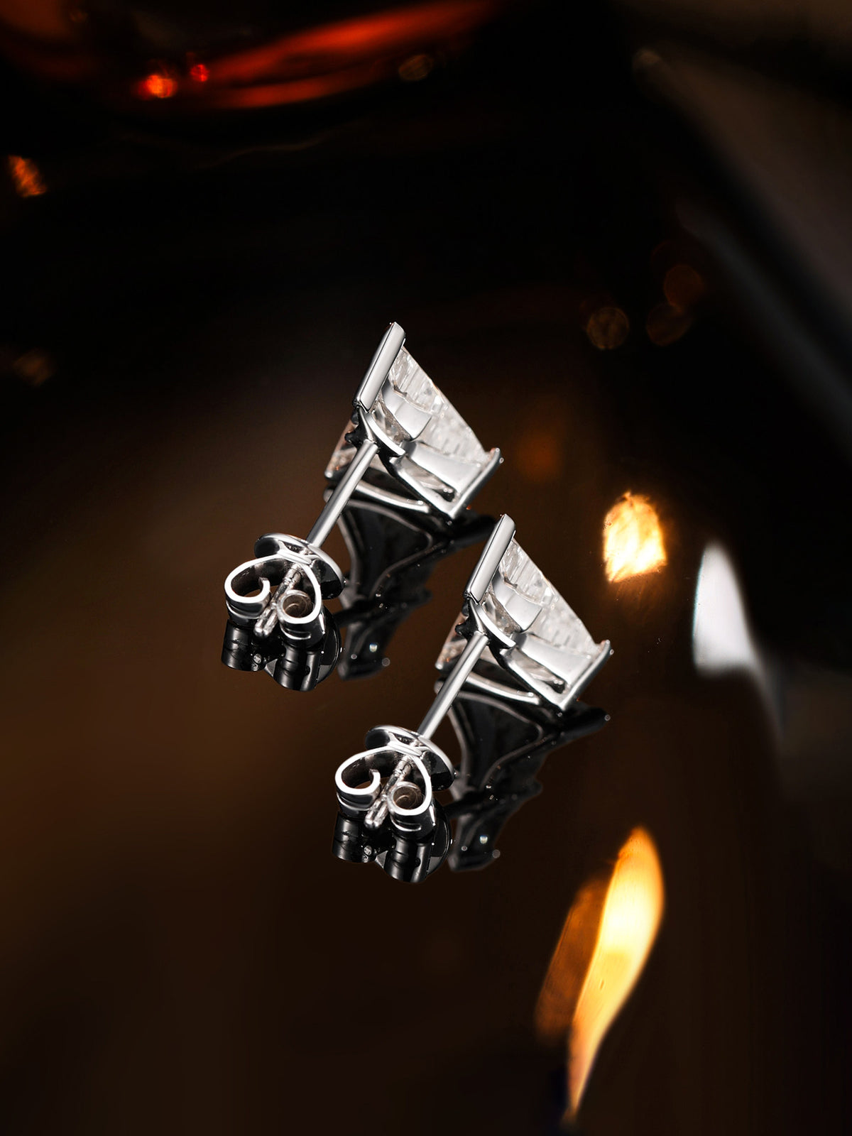 Side view of fighter jet diamond stud earrings, claw setting and butterfly backs
