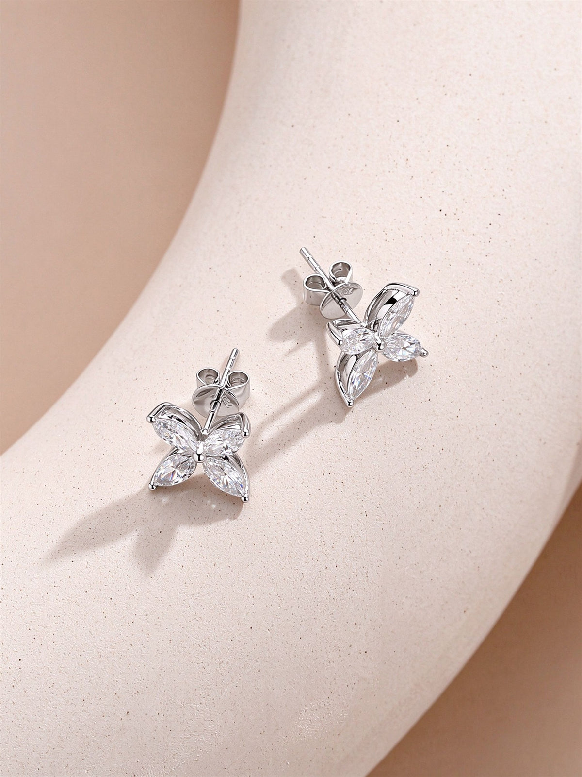 Platinum marquise diamond clover stud earrings showing the post and push back