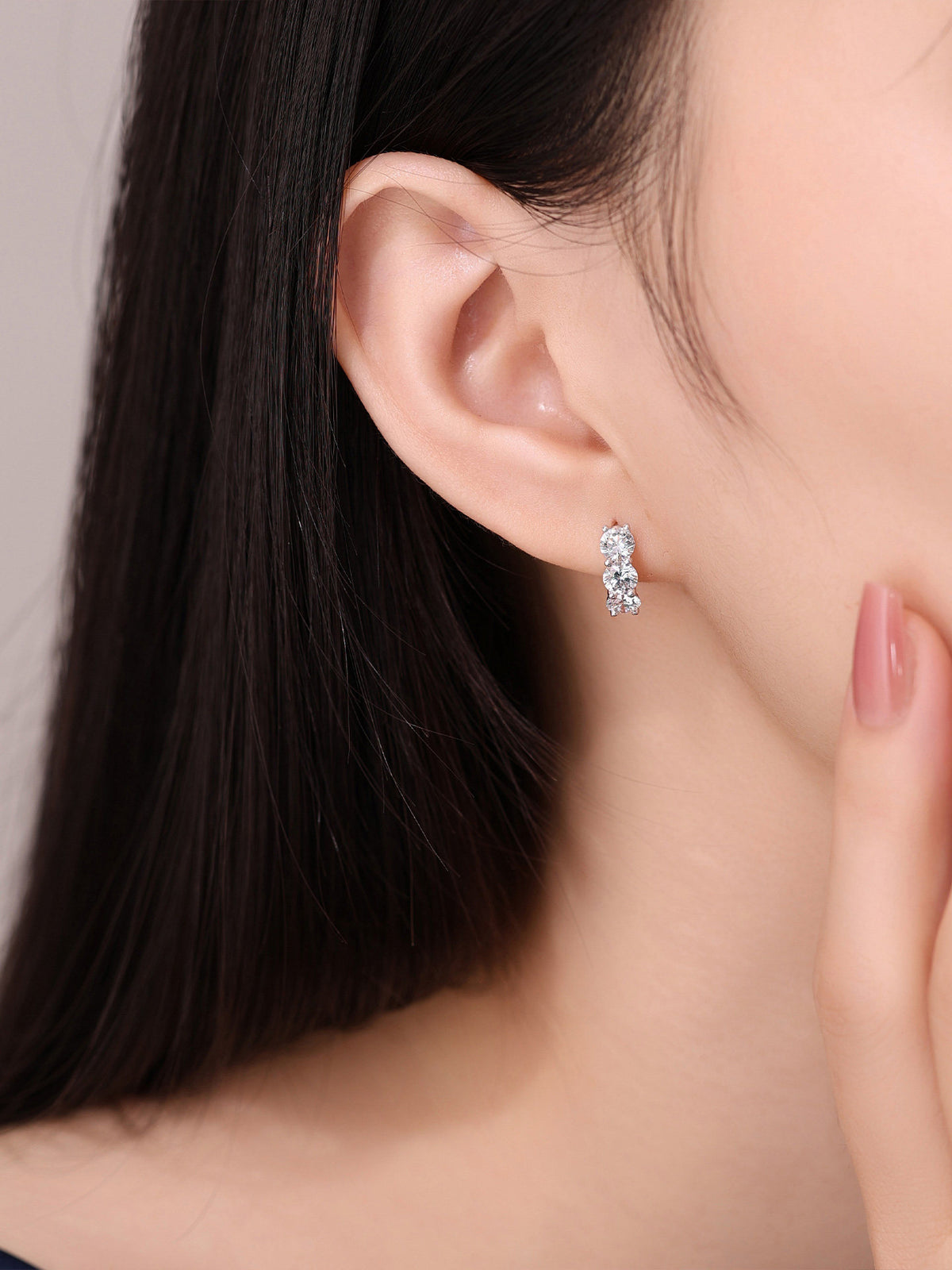 2 carat lab-grown diamond huggie earrings in 18K gold on model
