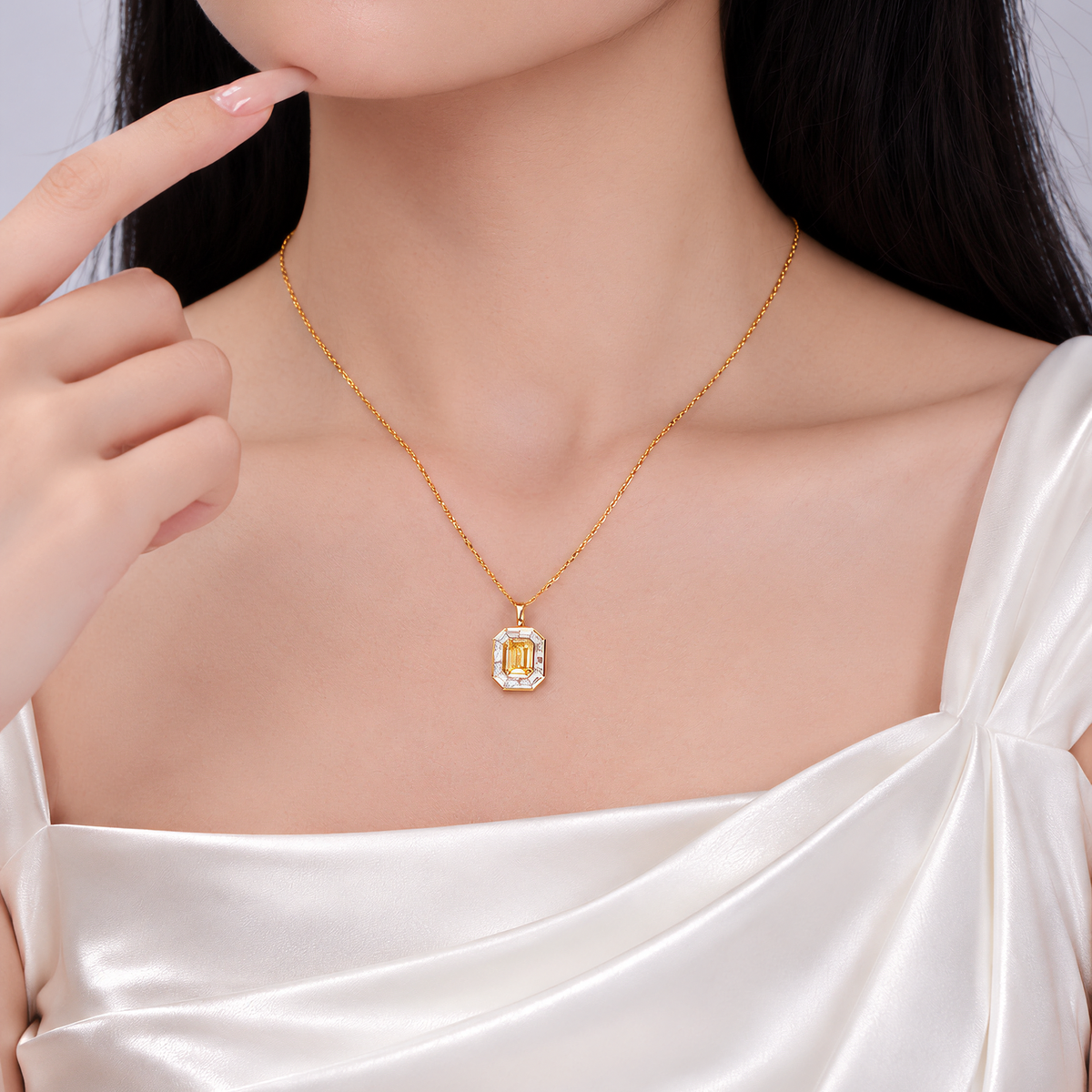 DANFÉE 1 carat fancy yellow emerald-cut halo necklace worn at the collarbone