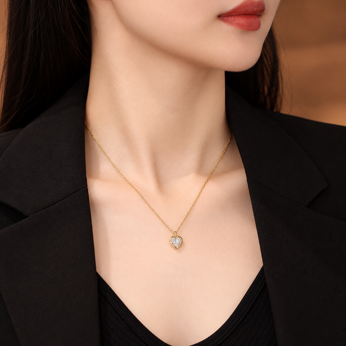 DANFÉE heart bezel diamond necklace worn with a black blazer