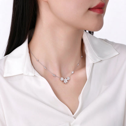 Daisy lab-grown diamond necklace worn with a white shirt