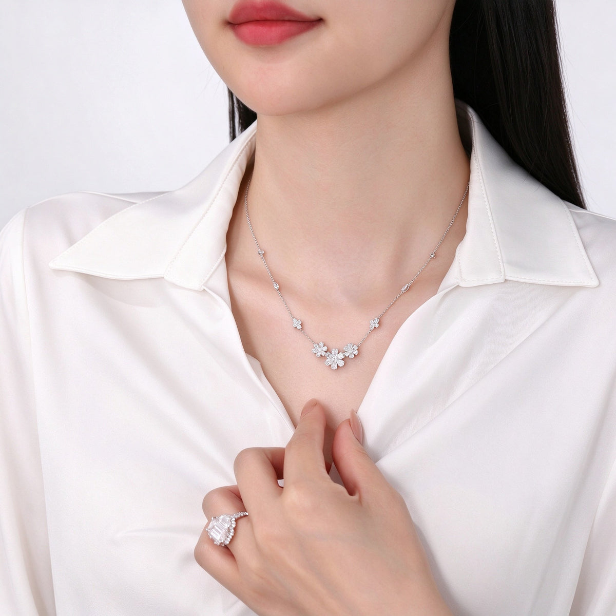 Daisy lab-grown diamond necklace worn with a white shirt