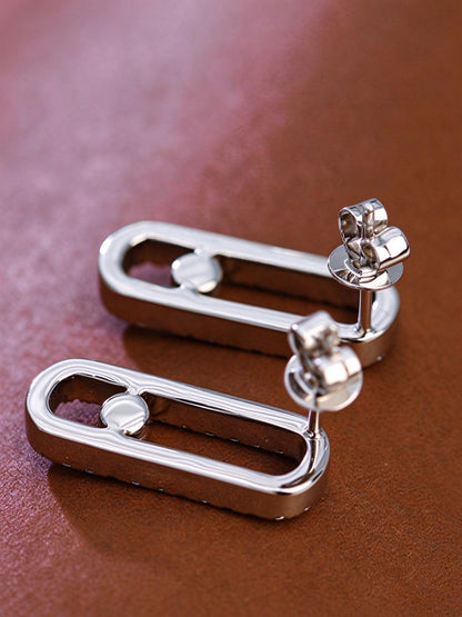 Back view of 18K gold paperclip stud earrings showing polished frame and push backs