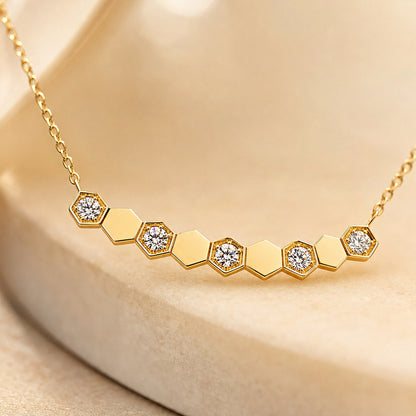 Close-up of DANFÉE Hive hexagon lab-grown diamonds in 18K gold