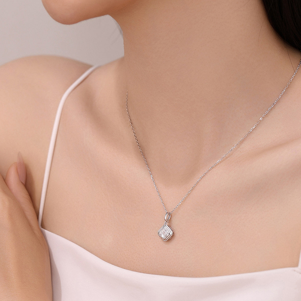 Model wearing the DANFÉE Deco Asscher lab-grown diamond pendant necklace in white gold