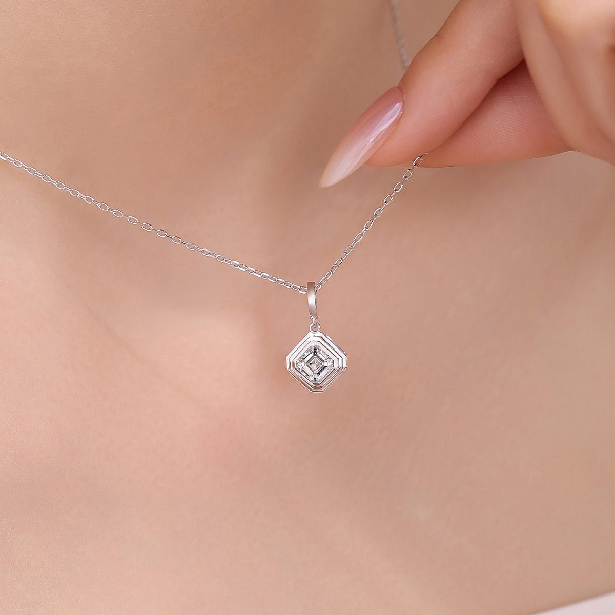 Close-up of the DANFÉE Deco Asscher pendant necklace worn at the collarbone