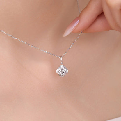 Close-up of the DANFÉE Deco Asscher pendant necklace worn at the collarbone