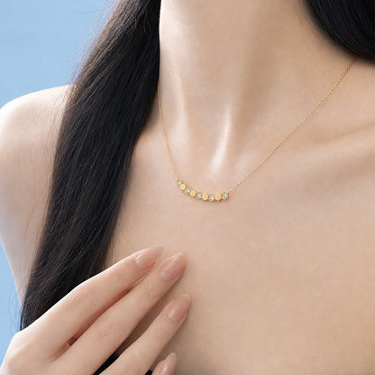 Model wearing DANFÉE Hive lab-grown diamond necklace in 18K yellow gold