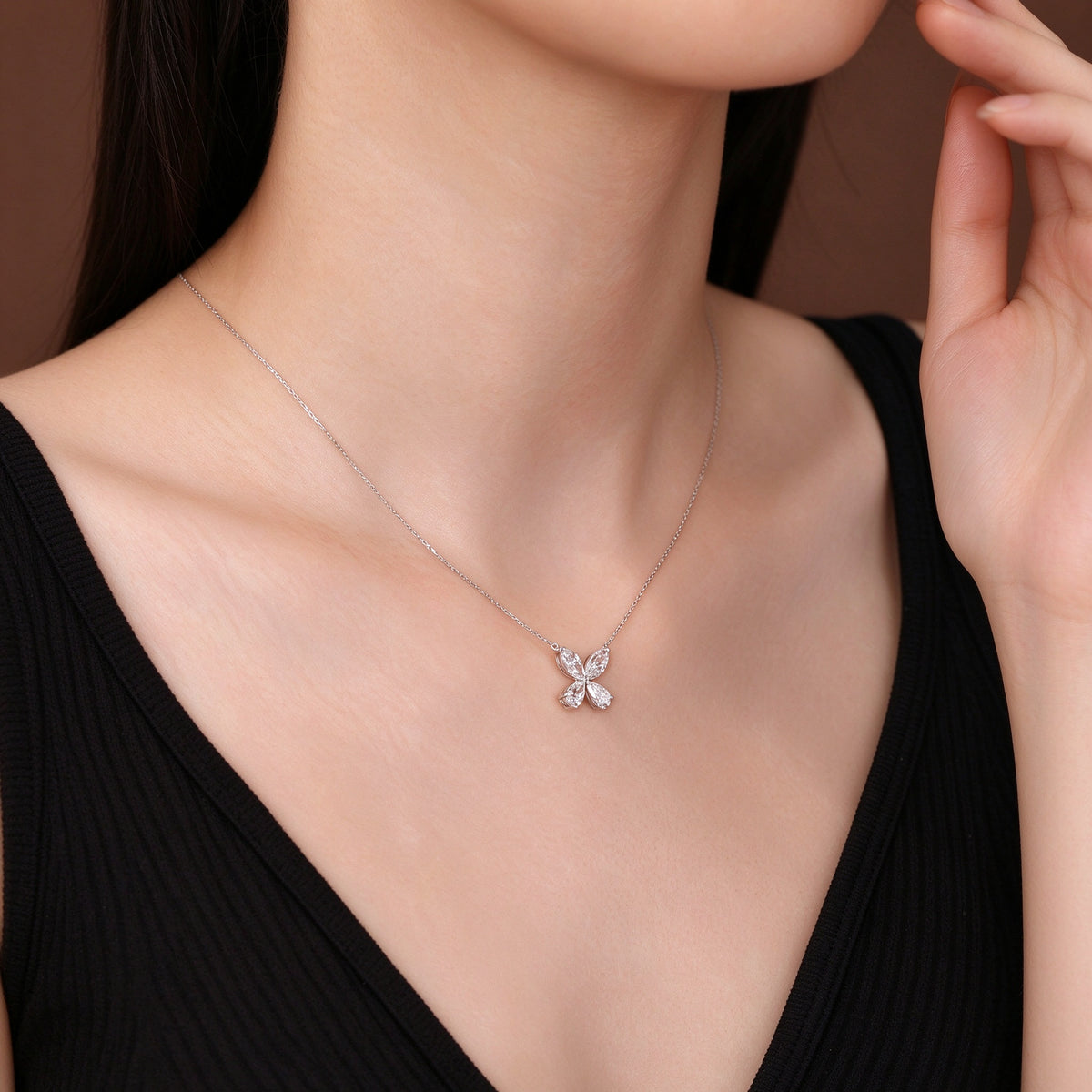 DANFÉE Four-Leaf Clover lab-grown diamond necklace worn by model, hand detail