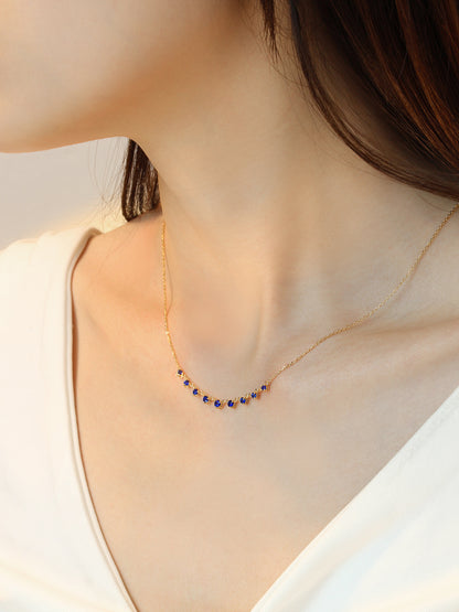 DANFÉE Nine-Stone Smile sapphire necklace worn at the collarbone