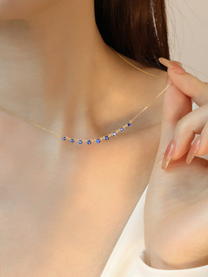 DANFÉE 0.56 carat Vivid Blue sapphire necklace on model, close-up