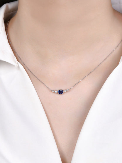 DANFÉE 0.45 carat oval sapphire and diamond necklace on model, front view