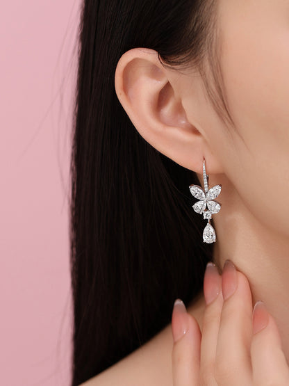 Butterfly pear-drop diamond earring worn on the ear