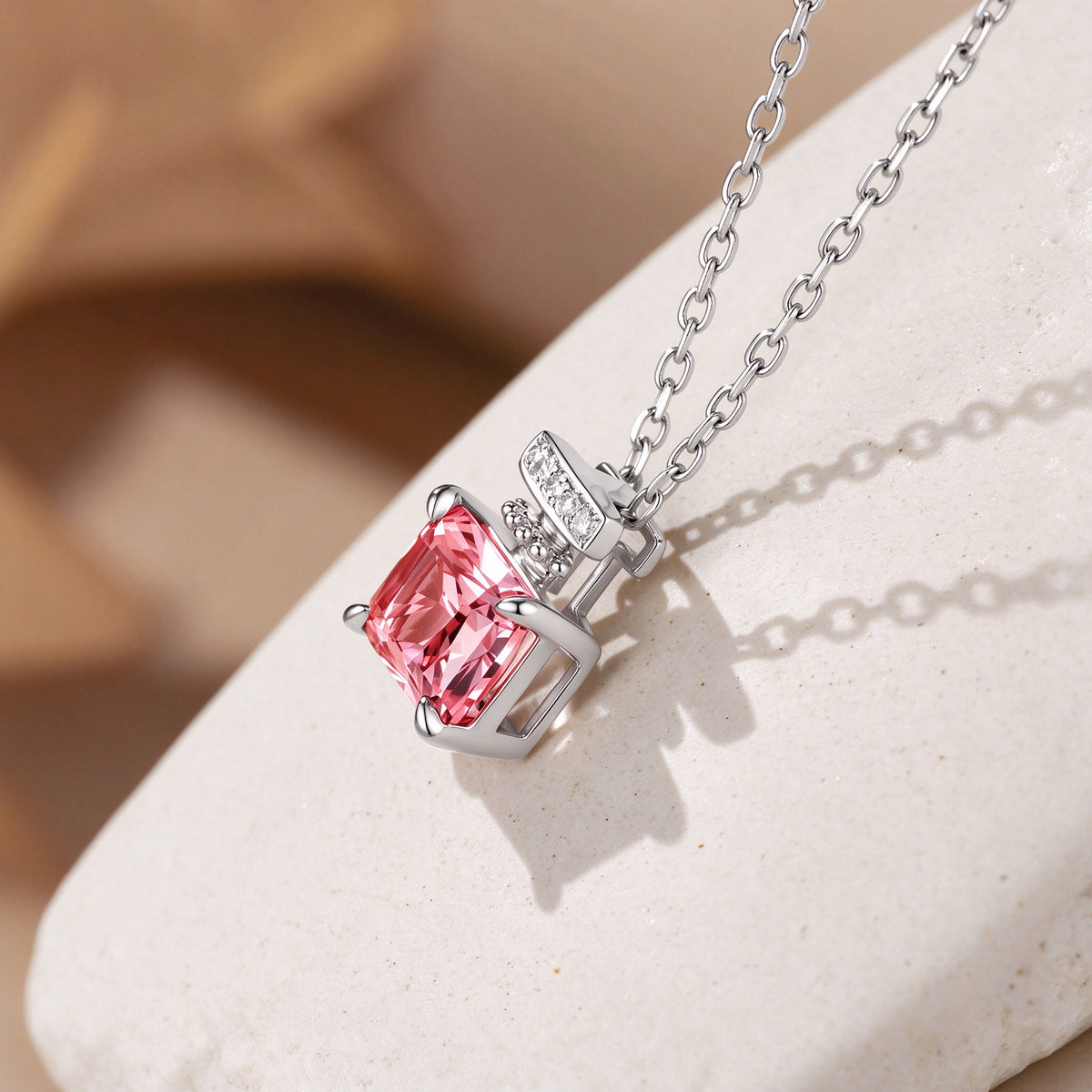 Parfum pendant in 18K white gold with pink lab-grown diamond, angled view