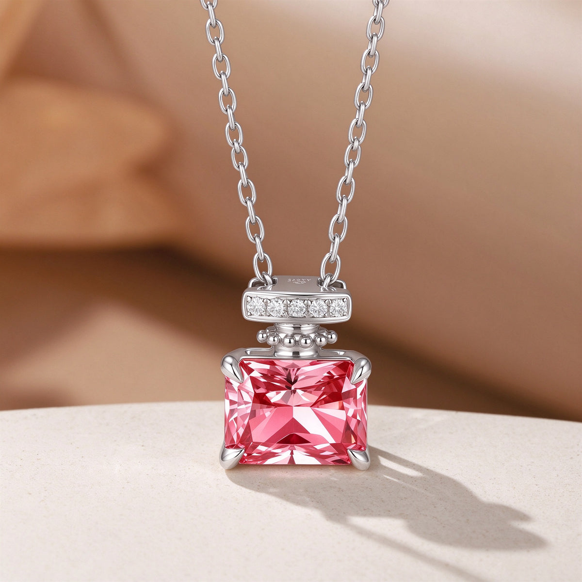 Close-up of the Fancy Vivid Pink radiant-cut lab-grown diamond in the Parfum necklace